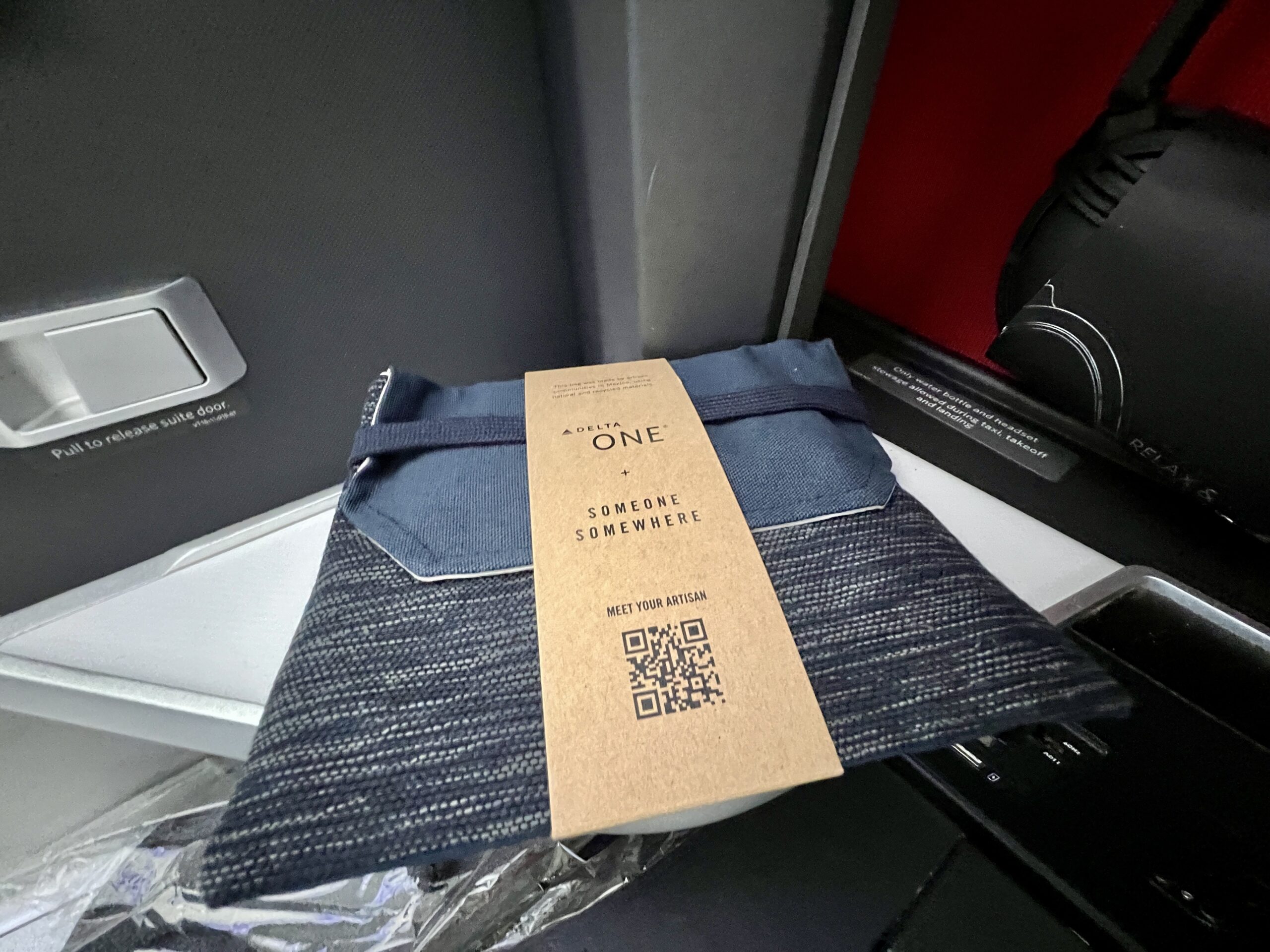 amenity kit for delta one flyers in a fabric pouch