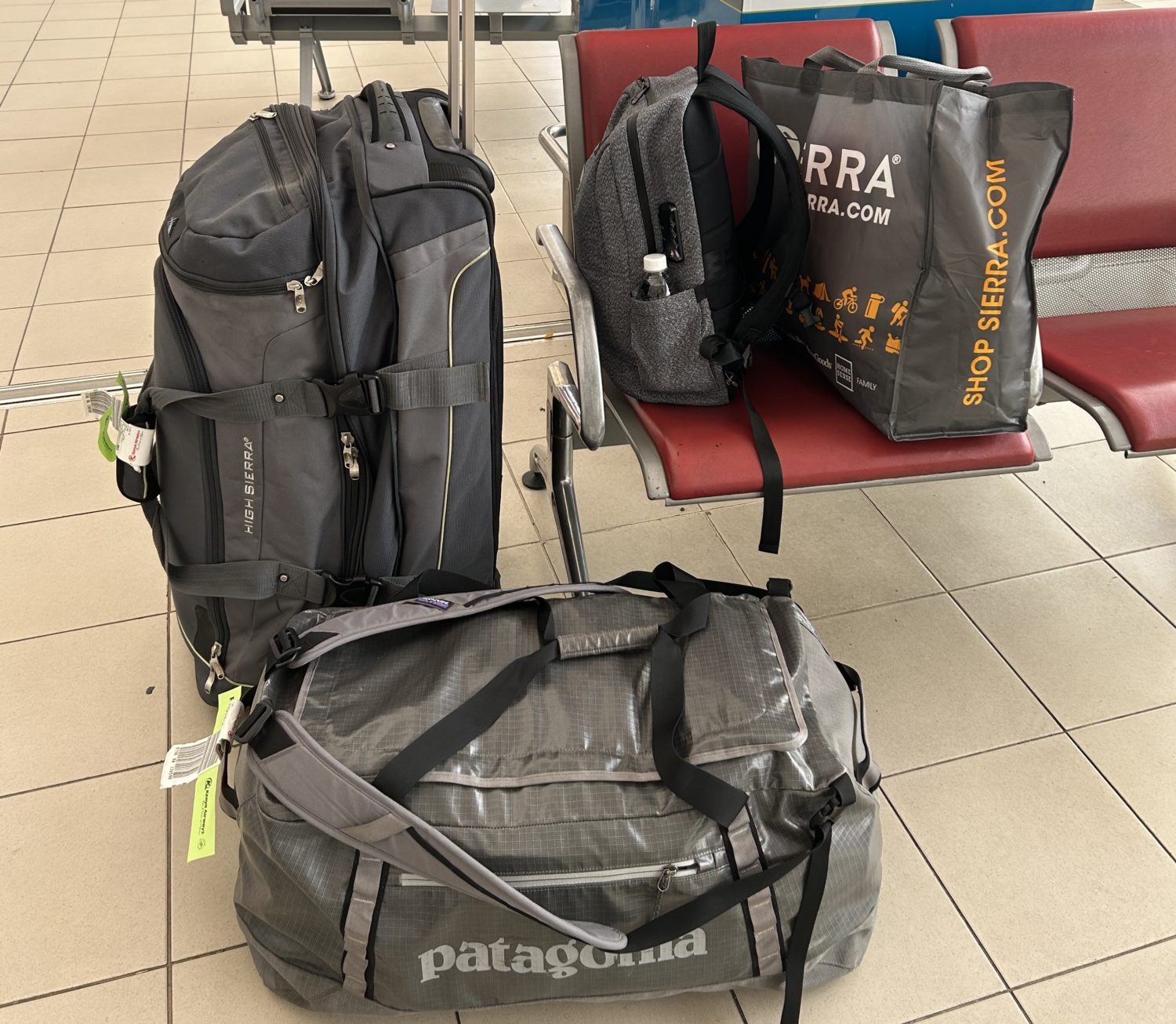 A pile of luggage sitting on top of a suitcase