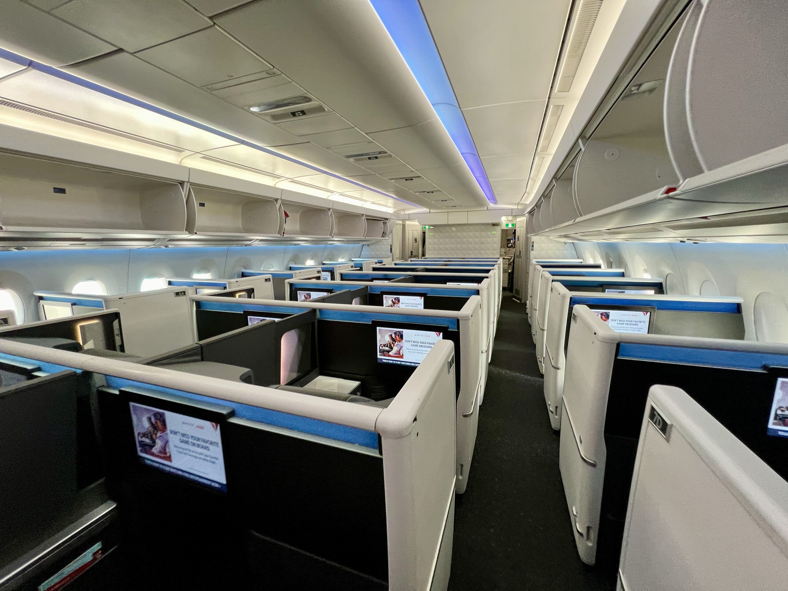 rows of business class suites on a delta jet