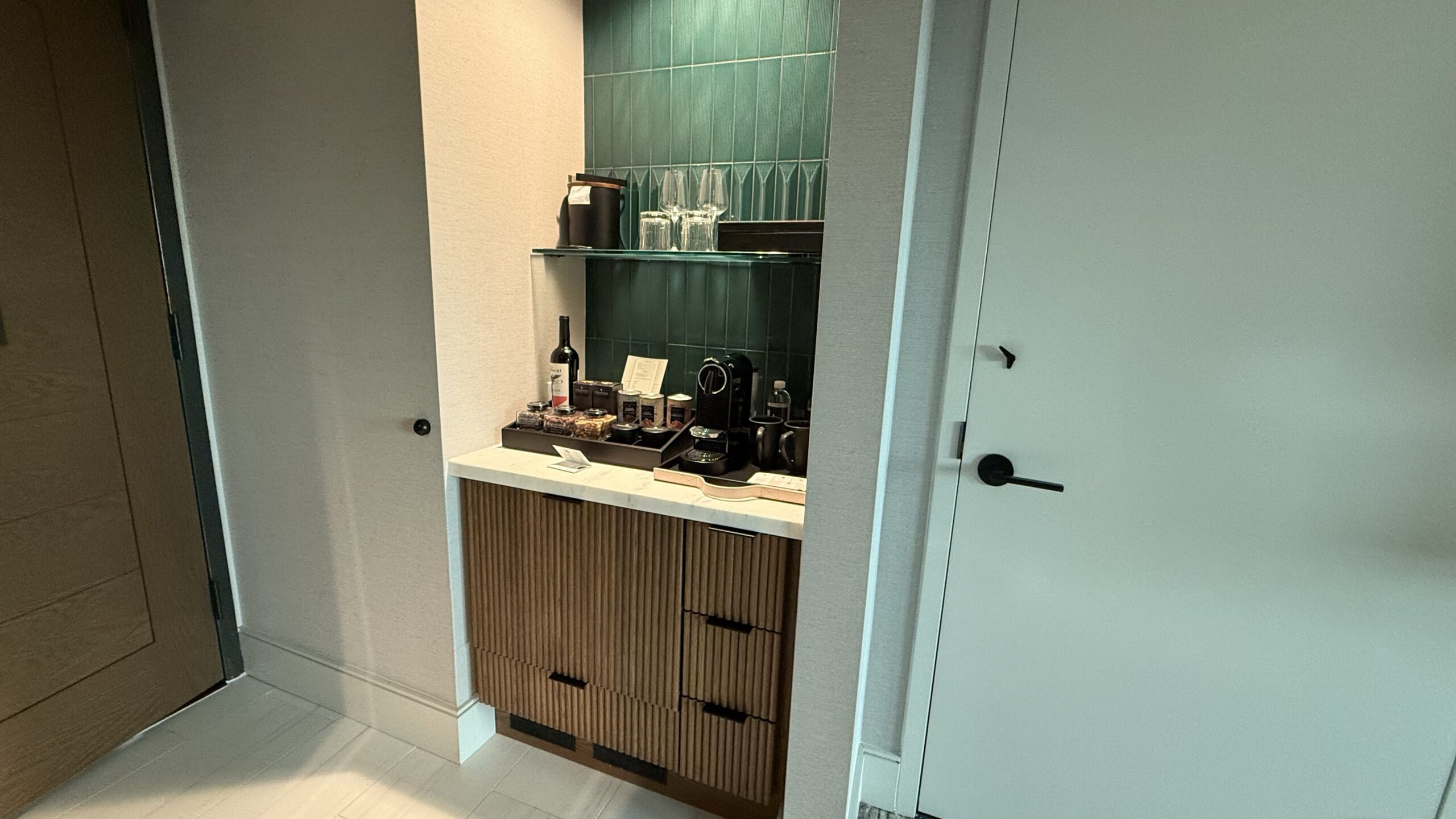 hotel room door and cabinet with mini bar. 