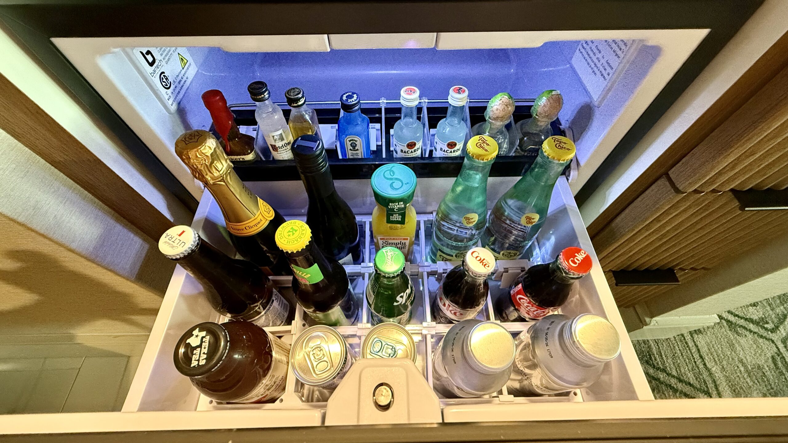 Mini bar drinks: Soda, beer, juice, and water. 