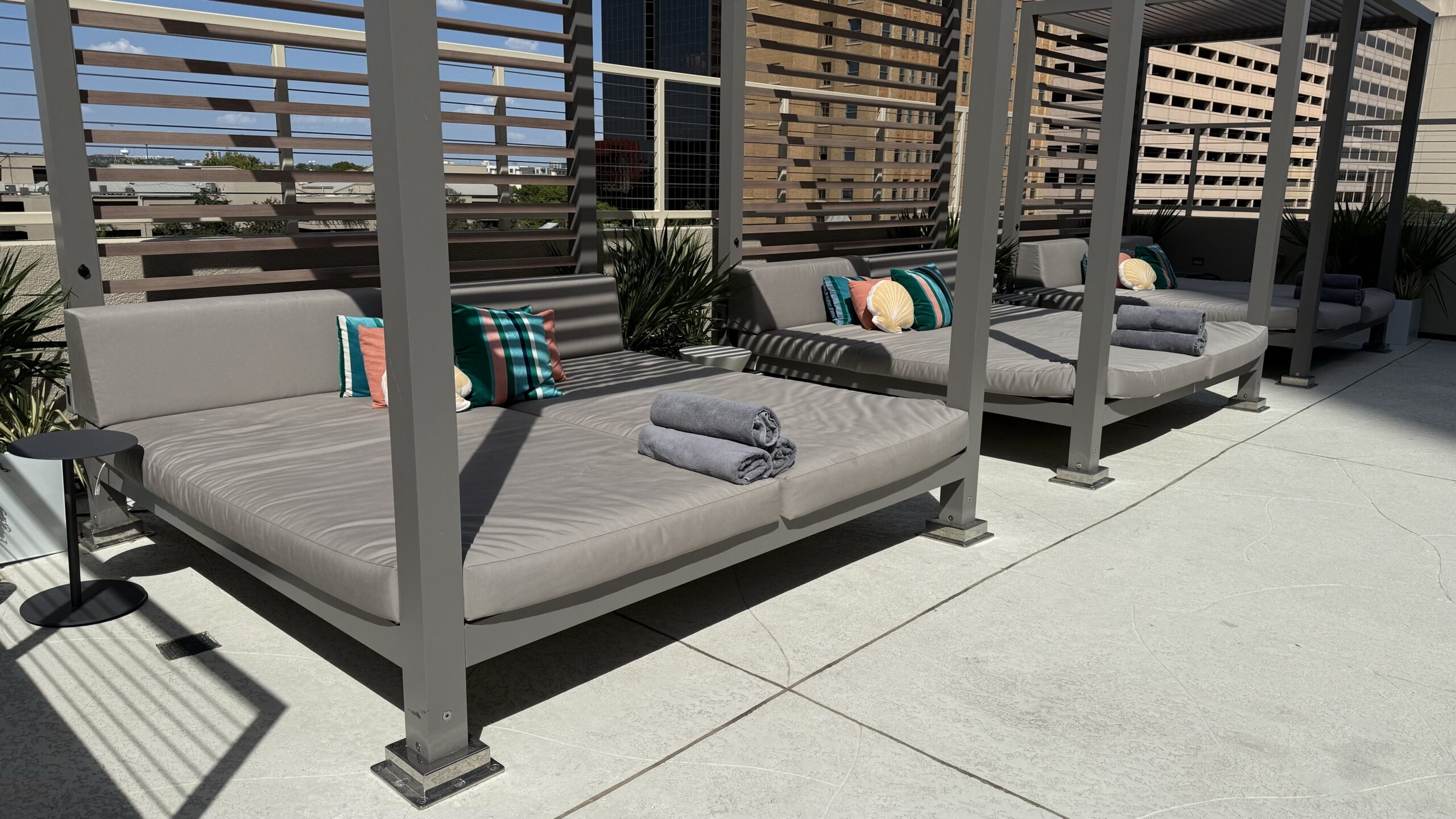 three daybeds on a sunny rooftop