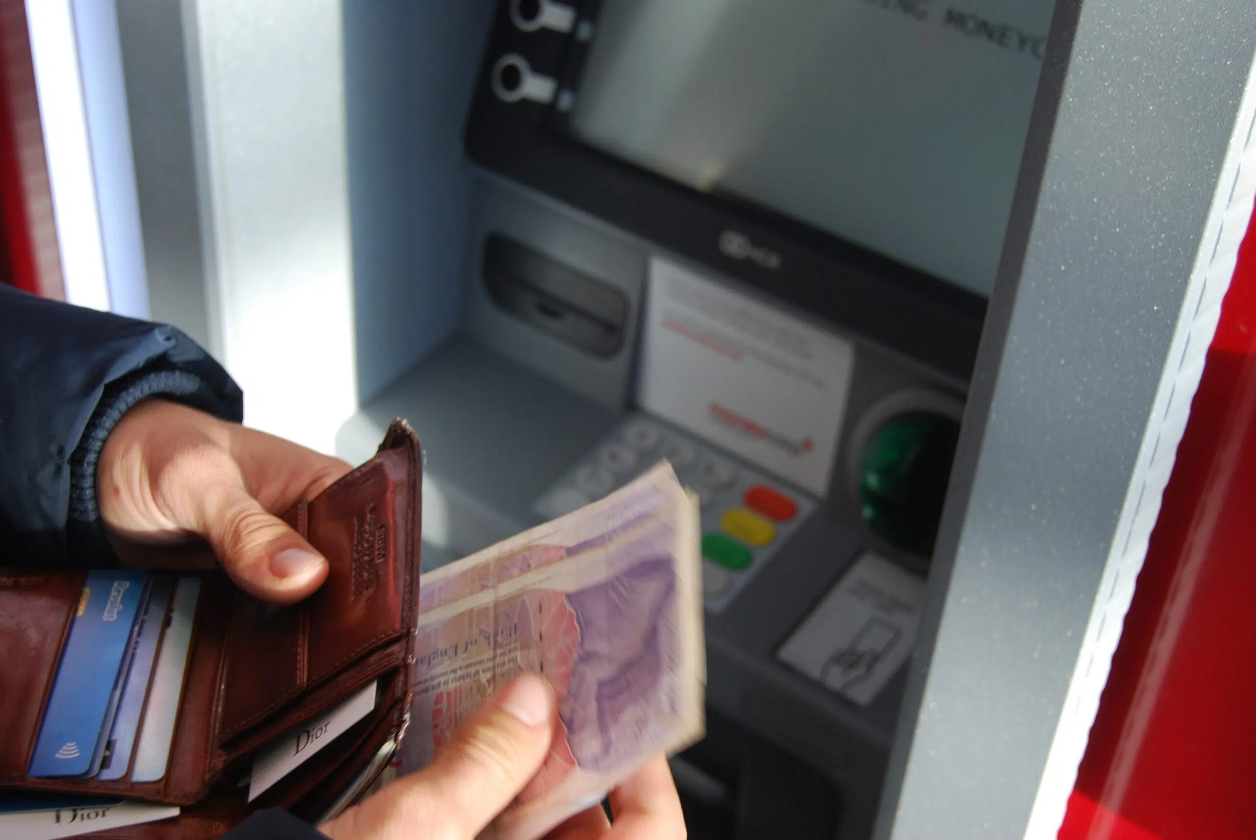 person withdrawing money from an ATM