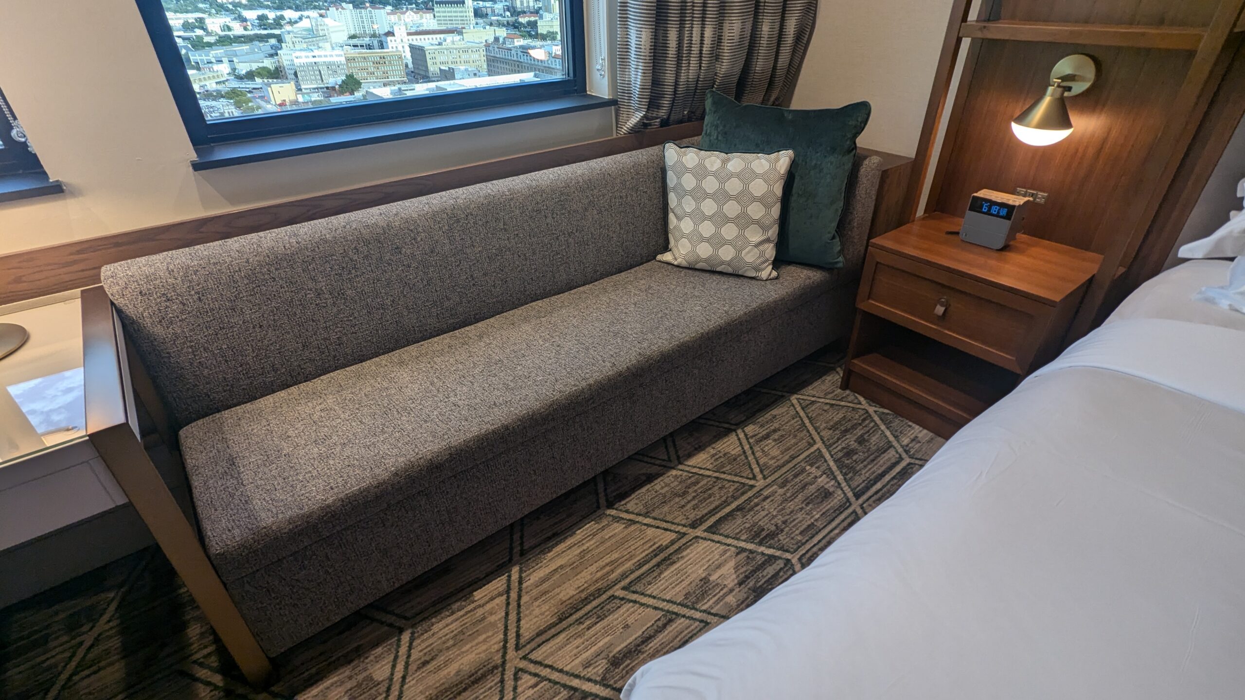 Couch and nightstand in a hotel room