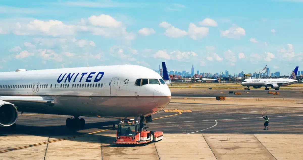 A large passenger jet sitting on top of a tarmac at an airport