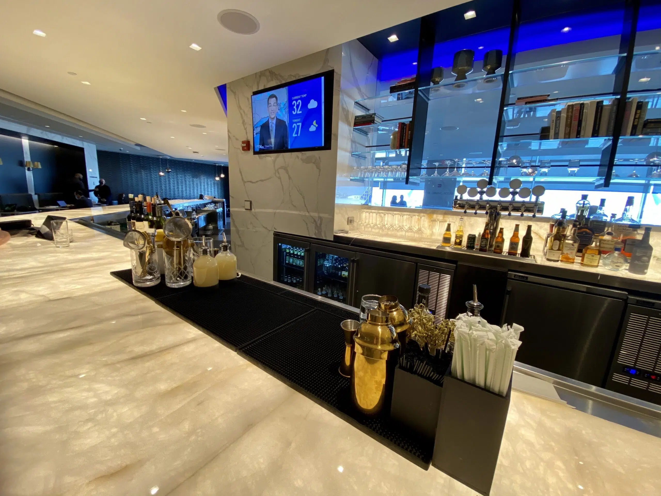 bar with marble top and drinks on top