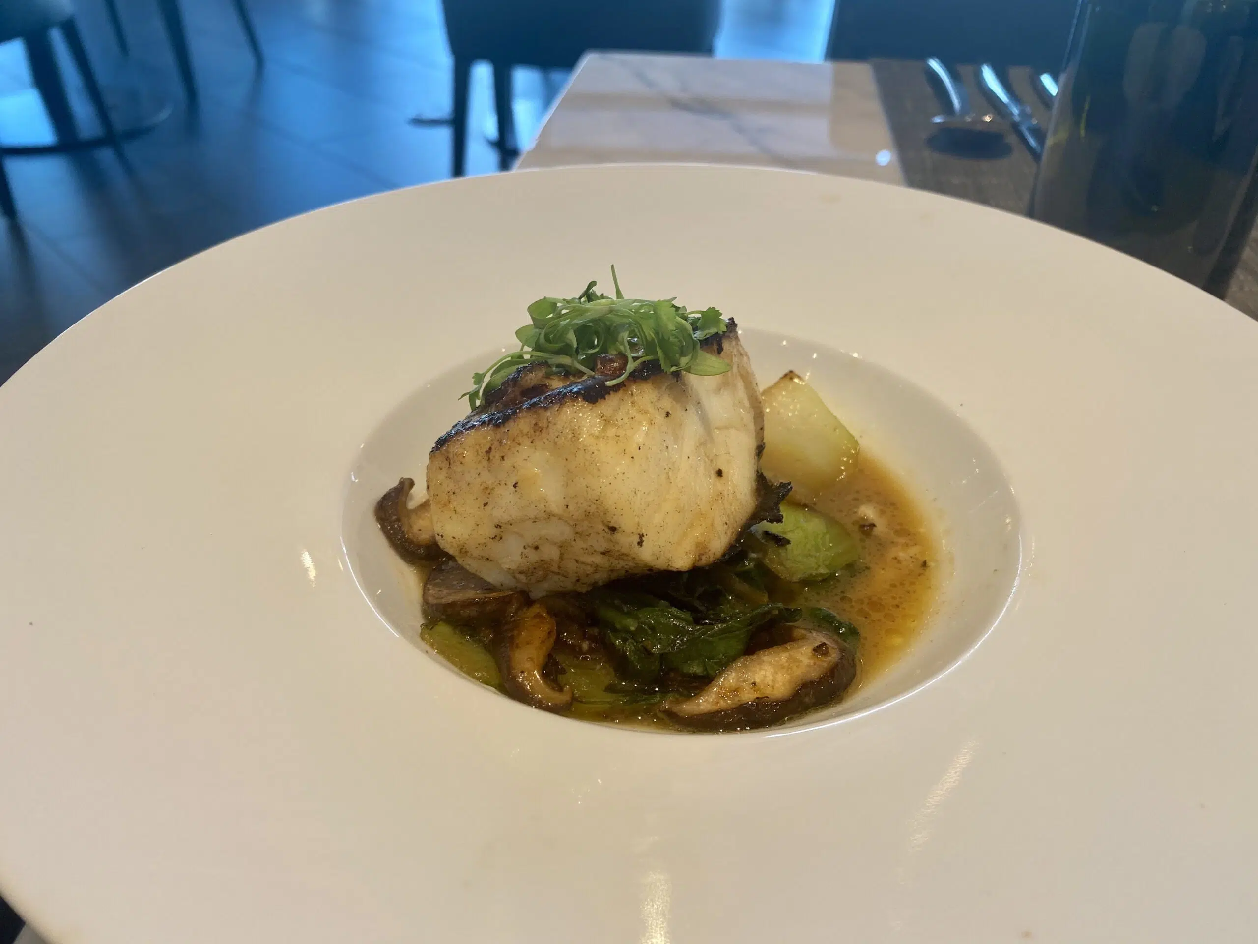 miso cod in a broth in a large bowl