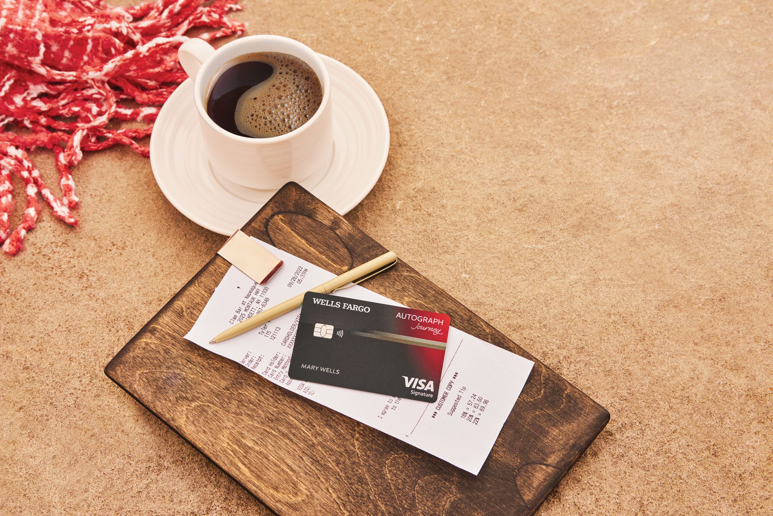 Wells Fargo autograph credit card with a cup of coffee